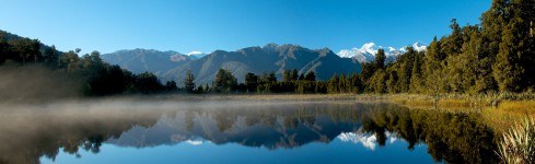 panoramic view of Lake Matheson mist in the early morning sun in autumn