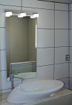 Elliptical basin and mirror in the bathroom